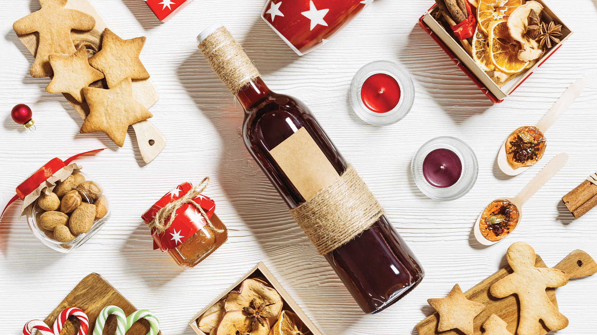 An assortment of cookies and wine on a table